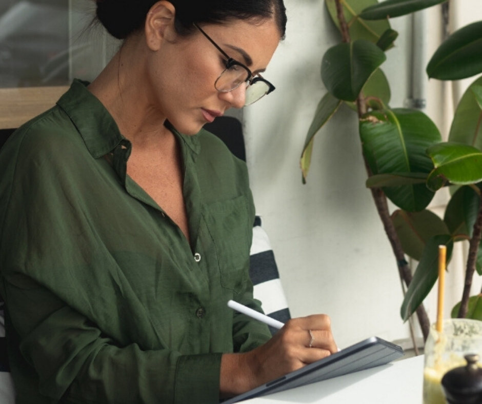 Woman Working On Tablet