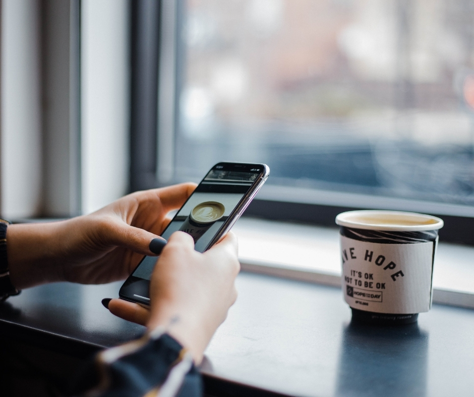 Person Taking A Photo Of A Cup On Smartphone