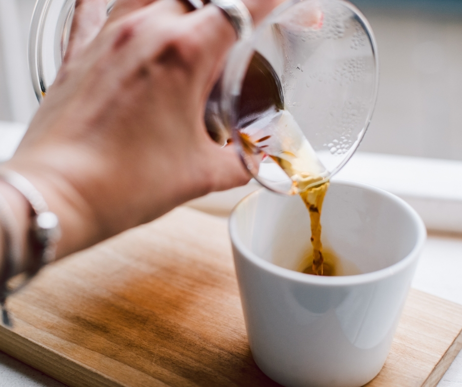 Coffee Being Poured Into Mug