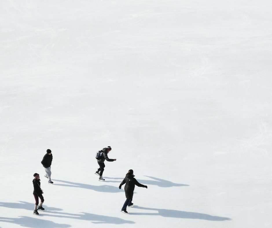 Aerial Shot Of Four People Ice Skating