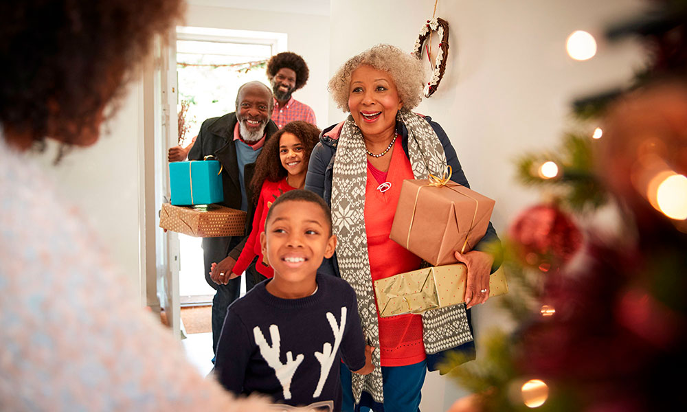 Family Arrives With Christmas Gifts