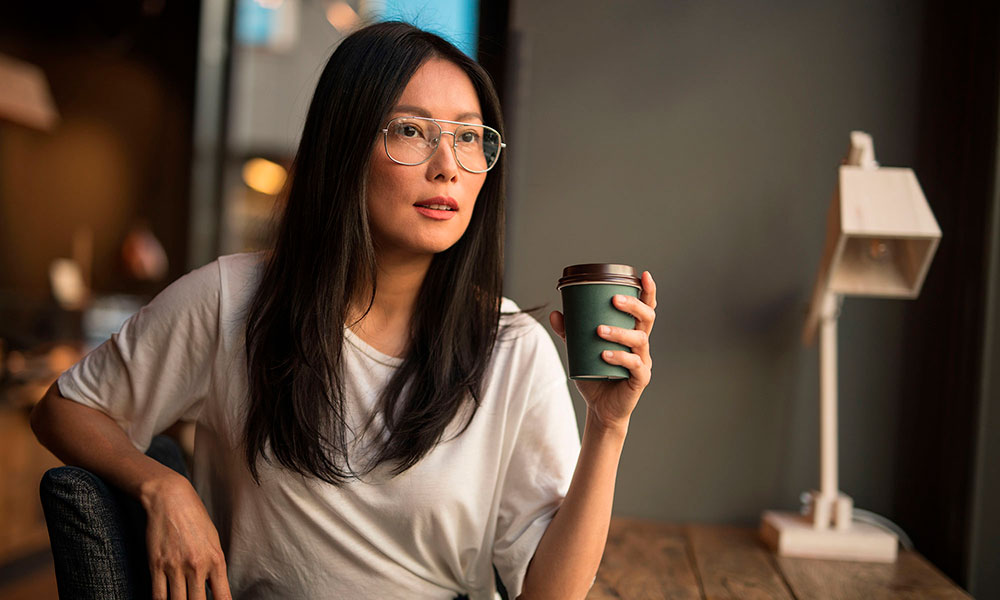 Woman With Coffee Cup In Hand