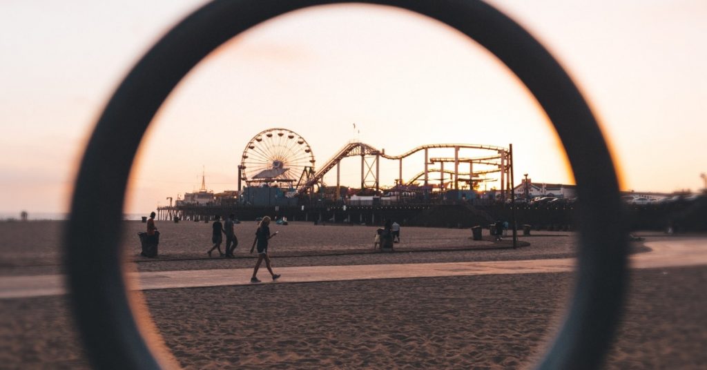 Roller Coaster & Ferris Wheel On A Pier