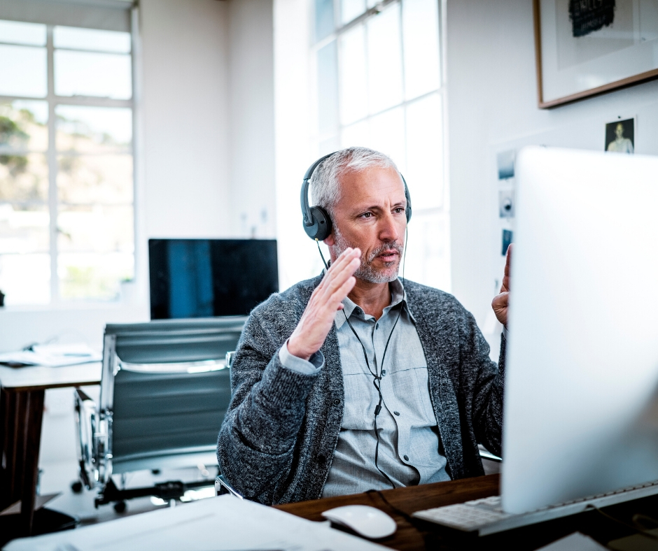 Man In Headphones On Computer