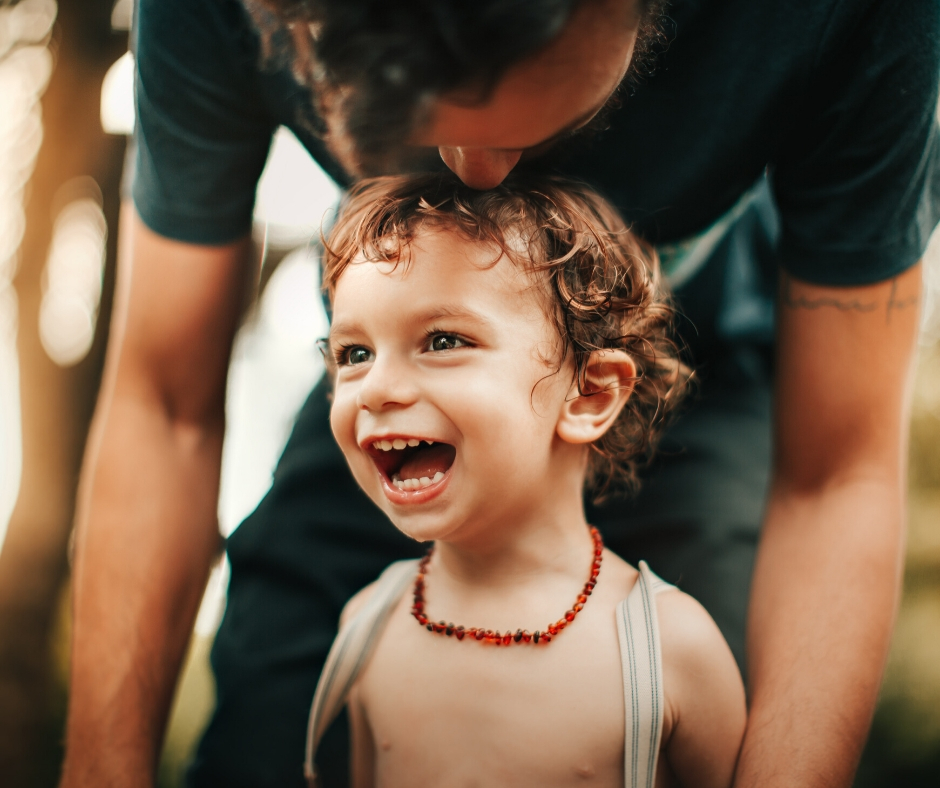 Smiling Child With Father