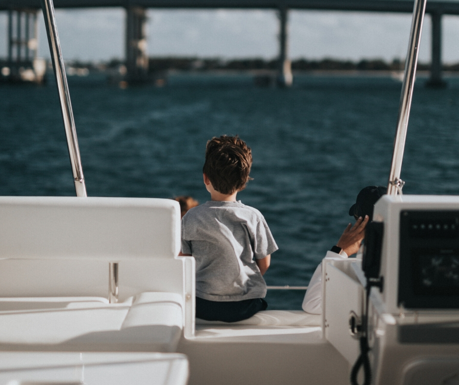 Boy On A Boat Looking Out At Water