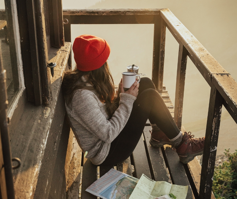 Woman On Deck Overlooking Lake